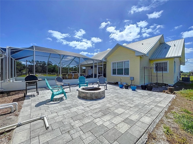 3108 Tom Matthews Rd, Lakeland, FL 33810 - view of patio featuring an outdoor fire pit and glass enclosure