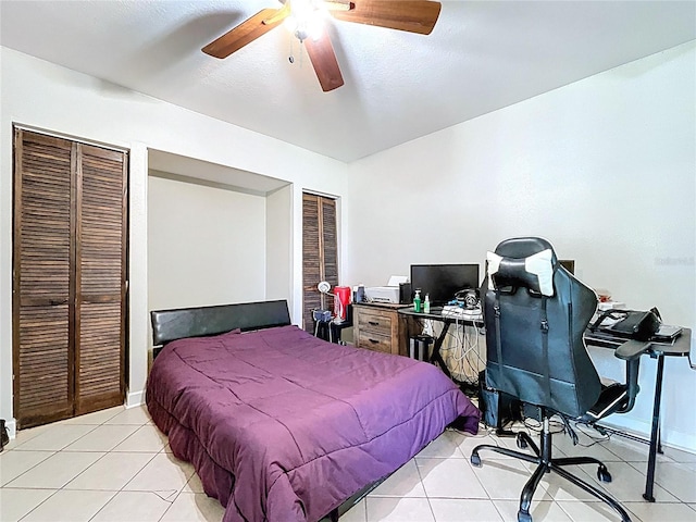 3108 Tom Matthews Rd, Lakeland, FL 33810 - bedroom featuring two closets, light tile patterned floors, a desk, and a ceiling fan