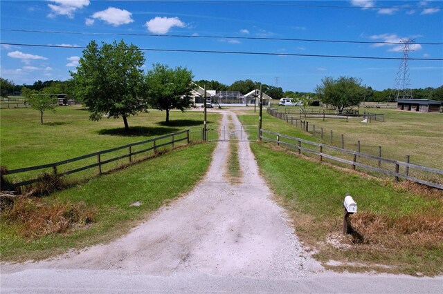 3108 Tom Matthews Rd, Lakeland, FL 33810 - view of dirt / gravel road featuring a gated entry and a rural view