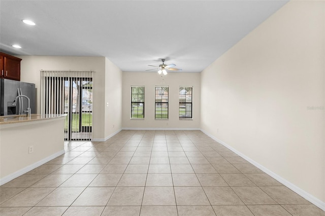 30151 Goodwick Way, Wesley Chapel, FL 33543 - unfurnished living room with ceiling fan, plenty of natural light, light tile patterned floors, and recessed lighting