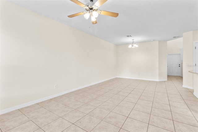 30151 Goodwick Way, Wesley Chapel, FL 33543 - spare room with ceiling fan, light tile patterned floors, and a chandelier