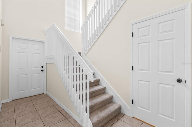 30151 Goodwick Way, Wesley Chapel, FL 33543 - entryway with light tile patterned floors and stairway