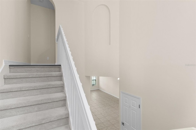 30151 Goodwick Way, Wesley Chapel, FL 33543 - stairway with baseboards and a high ceiling
