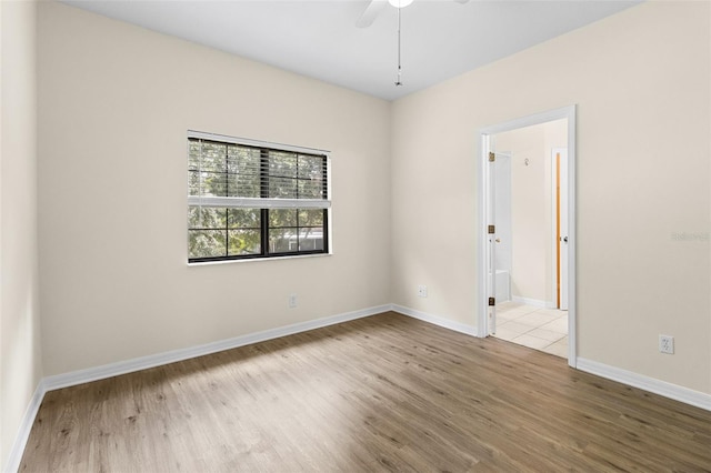 30151 Goodwick Way, Wesley Chapel, FL 33543 - spare room with wood finished floors and a ceiling fan