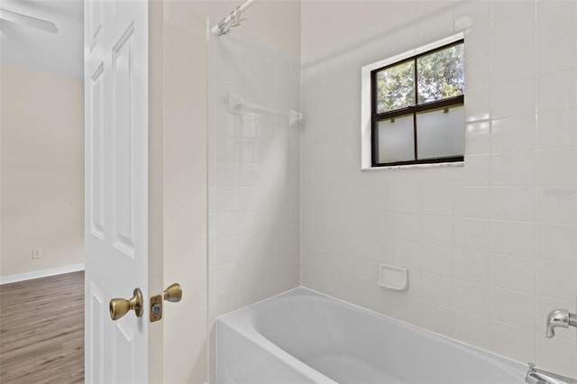 30151 Goodwick Way, Wesley Chapel, FL 33543 - full bathroom featuring  shower combination and wood finished floors