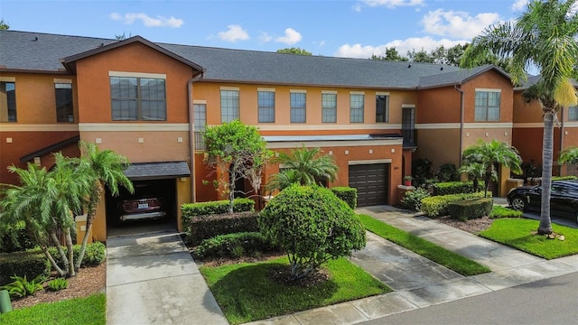 30151 Goodwick Way, Wesley Chapel, FL 33543 - view of property with driveway, a garage, and stucco siding