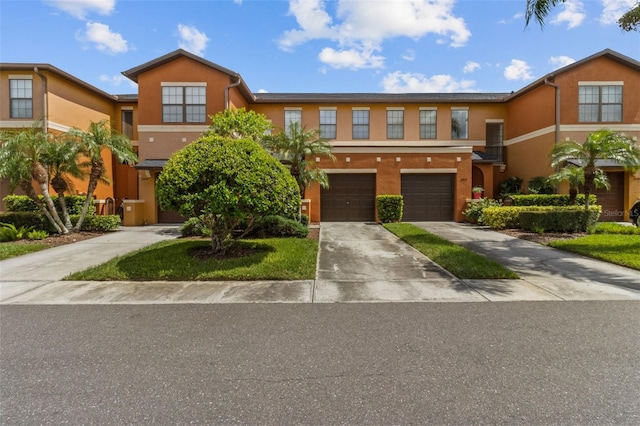 30151 Goodwick Way, Wesley Chapel, FL 33543 - multi unit property with driveway, stucco siding, and a garage
