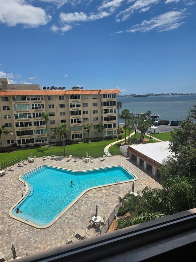 632 Edgewater Dr Unit 633, Dunedin, FL 34698 - community pool with a patio area and a water view