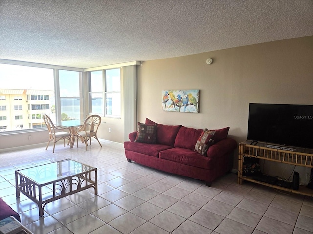 632 Edgewater Dr Unit 633, Dunedin, FL 34698 - living room with light tile patterned floors and a textured ceiling