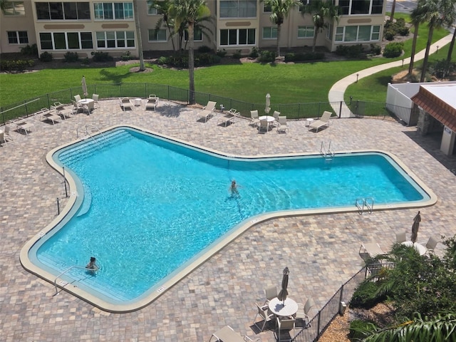 632 Edgewater Dr Unit 633, Dunedin, FL 34698 - community pool featuring a patio