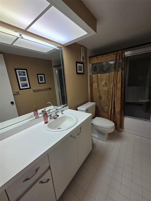 632 Edgewater Dr Unit 633, Dunedin, FL 34698 - full bathroom with vanity, tile patterned floors, and shower / tub combo with curtain