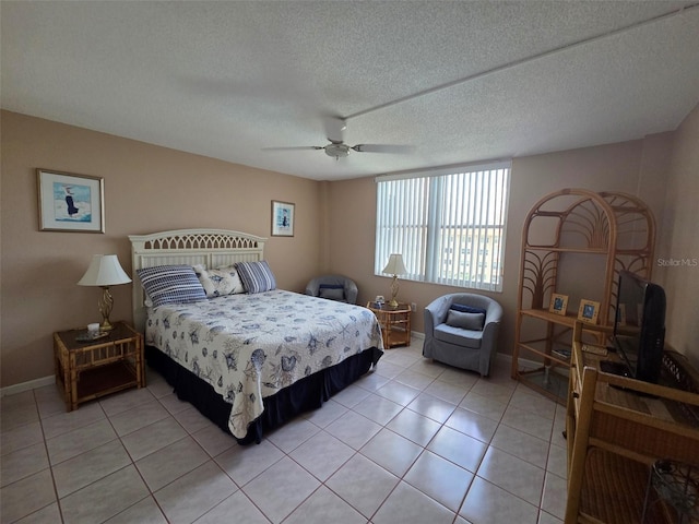 632 Edgewater Dr Unit 633, Dunedin, FL 34698 - bedroom with light tile patterned flooring, ceiling fan, and a textured ceiling