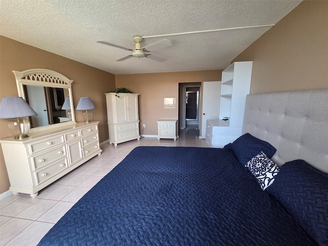 632 Edgewater Dr Unit 633, Dunedin, FL 34698 - unfurnished bedroom with light tile patterned flooring and a textured ceiling