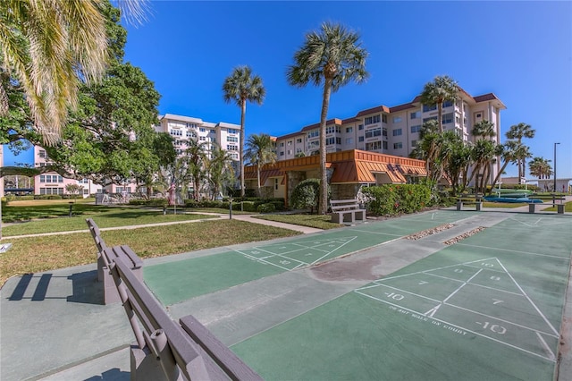 632 Edgewater Dr Unit 633, Dunedin, FL 34698 - surrounding community with shuffleboard and a yard