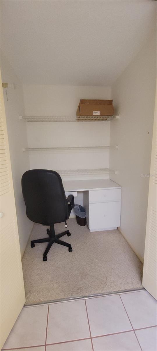 632 Edgewater Dr Unit 633, Dunedin, FL 34698 - office featuring light colored carpet and light tile patterned floors