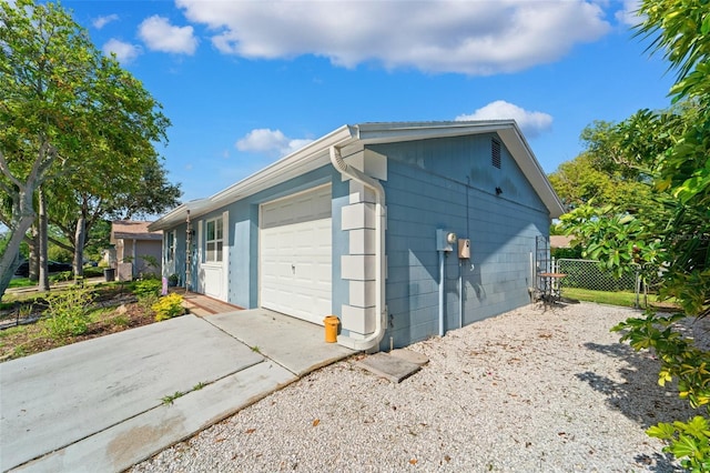 908 Toddsmill Trce, Tarpon Springs, FL 34689 - view of side of property featuring driveway and a garage
