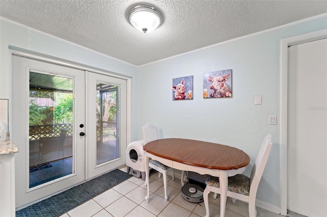 908 Toddsmill Trce, Tarpon Springs, FL 34689 - dining area featuring french doors, crown molding, a textured ceiling, and light tile patterned flooring