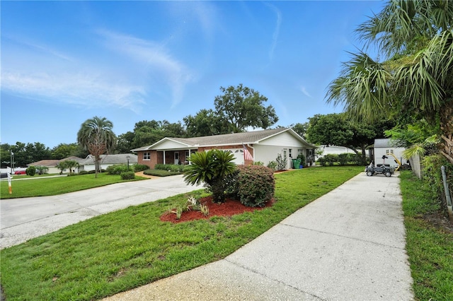5628 Cypress St, Zephyrhills, FL 33542 - ranch-style home featuring driveway and a front lawn