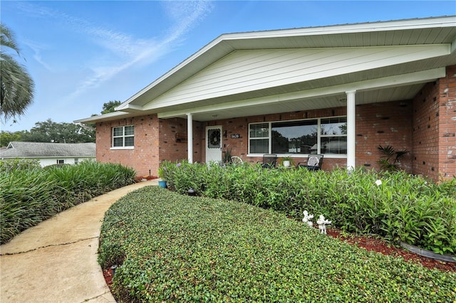 5628 Cypress St, Zephyrhills, FL 33542 - view of front of home featuring brick siding and covered porch