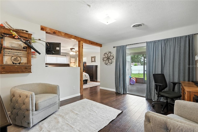 5628 Cypress St, Zephyrhills, FL 33542 - home office with hardwood / wood-style floors, a textured ceiling, and ceiling fan