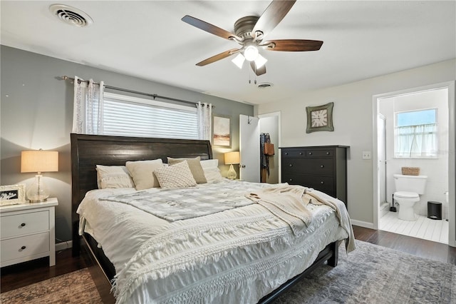 5628 Cypress St, Zephyrhills, FL 33542 - bedroom with dark wood finished floors, ensuite bathroom, and ceiling fan