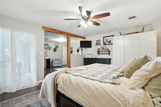 5628 Cypress St, Zephyrhills, FL 33542 - bedroom with dark wood-style flooring, beam ceiling, and ceiling fan