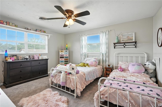 5628 Cypress St, Zephyrhills, FL 33542 - bedroom featuring carpet floors and ceiling fan