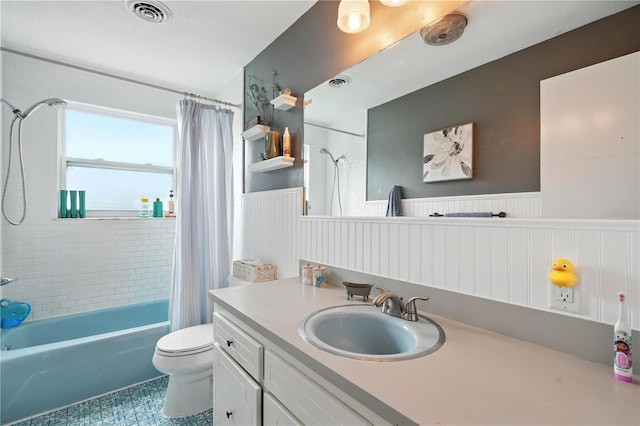 5628 Cypress St, Zephyrhills, FL 33542 - full bathroom with a wainscoted wall, shower / tub combo, and vanity