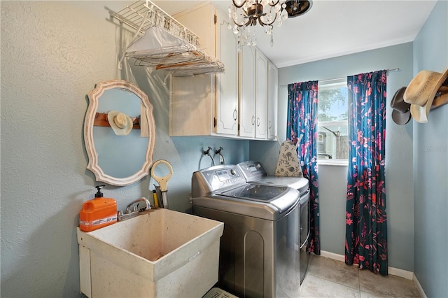 5628 Cypress St, Zephyrhills, FL 33542 - laundry area with independent washer and dryer, cabinet space, a chandelier, and light tile patterned floors