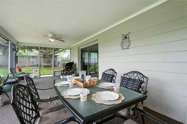 5628 Cypress St, Zephyrhills, FL 33542 - sunroom / solarium featuring a ceiling fan and outdoor dining area