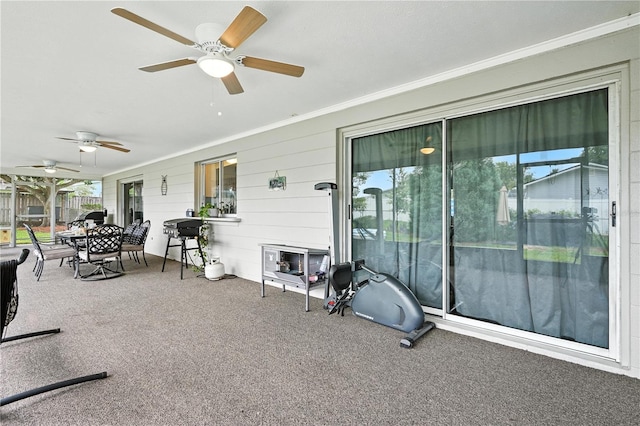 5628 Cypress St, Zephyrhills, FL 33542 - sunroom with ceiling fan and outdoor dining area