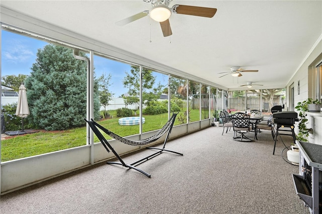 5628 Cypress St, Zephyrhills, FL 33542 - sunroom featuring a ceiling fan and outdoor dining space