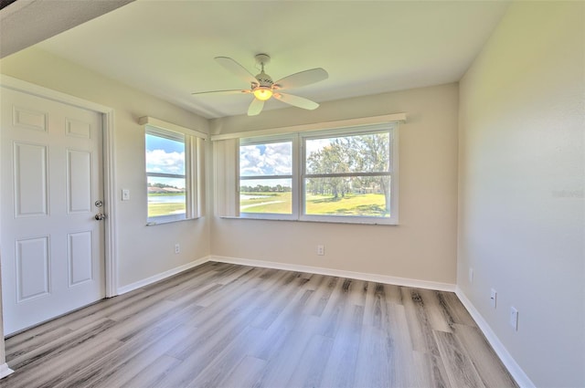 2012 Fall River Ct Unit 107, Sun City Center, FL 33573 - empty room featuring ceiling fan, healthy amount of natural light, and wood finished floors
