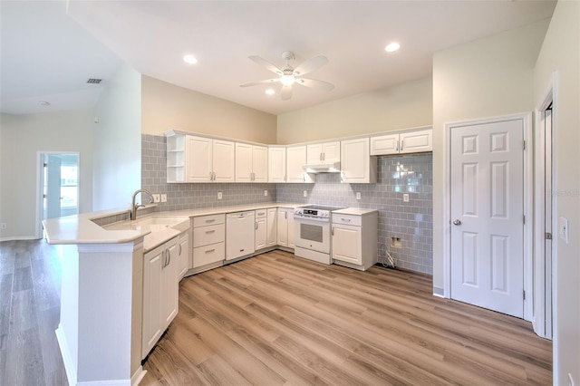 2012 Fall River Ct Unit 107, Sun City Center, FL 33573 - kitchen featuring white appliances, a peninsula, open shelves, ceiling fan, and light wood-style floors
