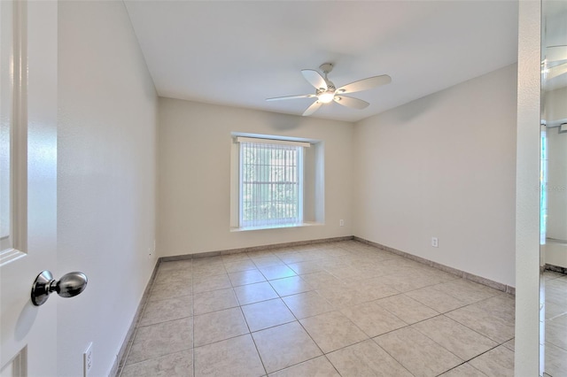2012 Fall River Ct Unit 107, Sun City Center, FL 33573 - empty room featuring a ceiling fan and light tile patterned floors