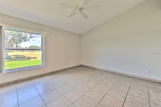 2012 Fall River Ct Unit 107, Sun City Center, FL 33573 - spare room featuring a ceiling fan, light tile patterned floors, and lofted ceiling