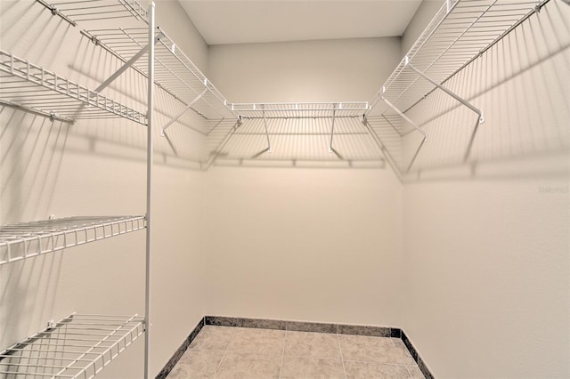 2012 Fall River Ct Unit 107, Sun City Center, FL 33573 - walk in closet featuring tile patterned flooring