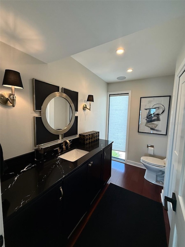 850 59th Ave, Saint Petersburg, FL 33706 - bathroom featuring vanity, wood finished floors, and recessed lighting