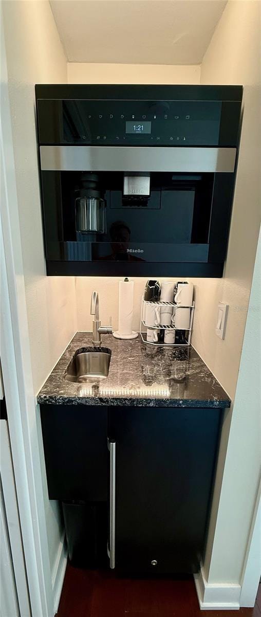 850 59th Ave, Saint Petersburg, FL 33706 - kitchen featuring a sink and dark stone countertops