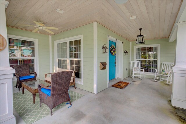 14 Evonaire Cir, Belleair, FL 33756 - porch featuring a ceiling fan