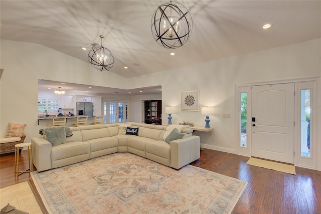 14 Evonaire Cir, Belleair, FL 33756 - living room featuring lofted ceiling, a chandelier, hardwood / wood-style flooring, and recessed lighting