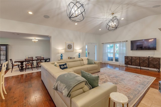 14 Evonaire Cir, Belleair, FL 33756 - living area featuring a chandelier, vaulted ceiling, recessed lighting, and wood finished floors