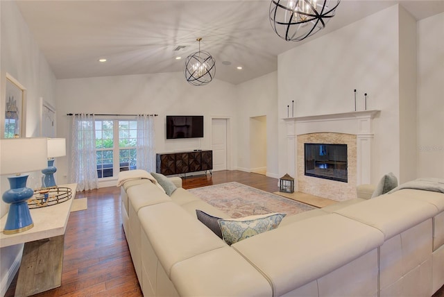 14 Evonaire Cir, Belleair, FL 33756 - living room with a chandelier, dark wood finished floors, a fireplace, recessed lighting, and high vaulted ceiling