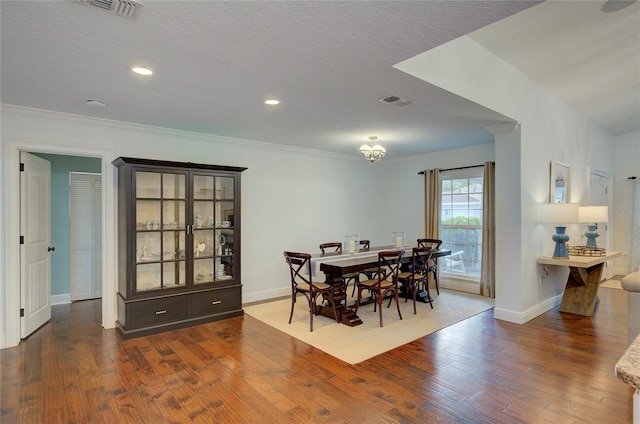 14 Evonaire Cir, Belleair, FL 33756 - dining area featuring hardwood / wood-style floors, crown molding, recessed lighting, and a textured ceiling