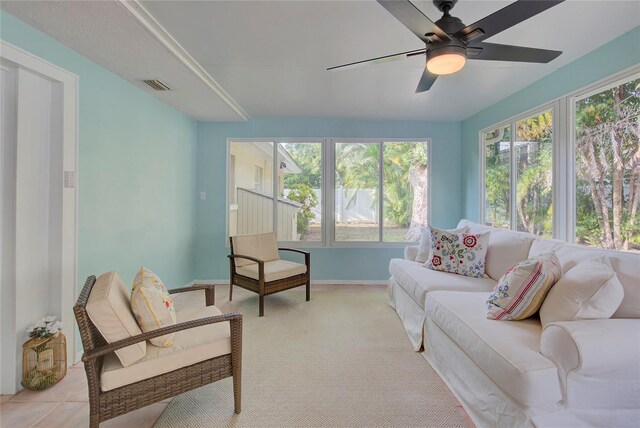 14 Evonaire Cir, Belleair, FL 33756 - living area with ceiling fan and light carpet