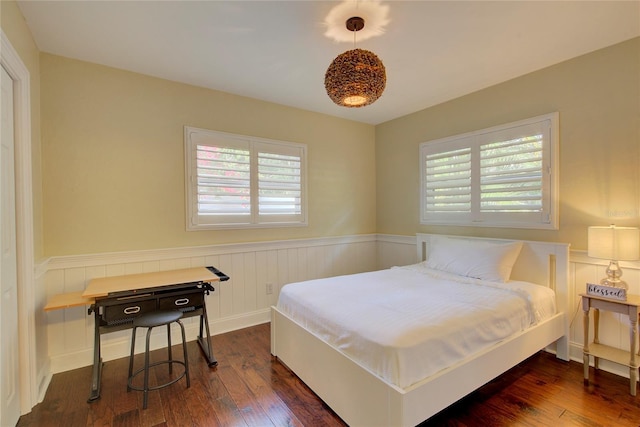 14 Evonaire Cir, Belleair, FL 33756 - bedroom with multiple windows, a wainscoted wall, and dark wood-style floors