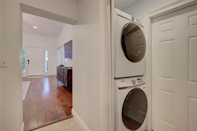 14 Evonaire Cir, Belleair, FL 33756 - laundry room featuring estacked washer and dryer, recessed lighting, and wood finished floors