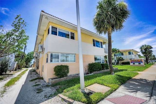 7740 Boca Ciega Dr Unit 204, St Pete Beach, FL 33706 - view of front of house featuring stucco siding
