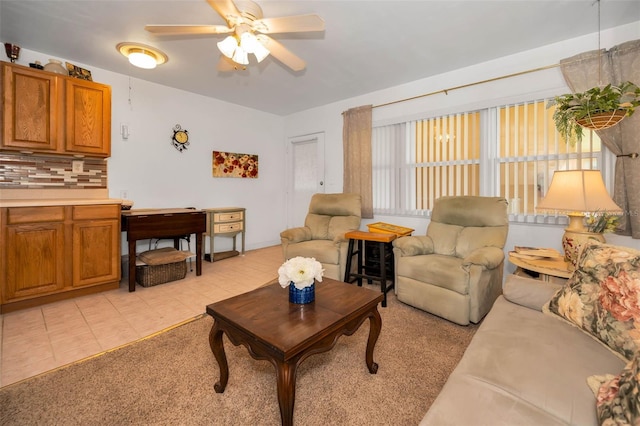 7740 Boca Ciega Dr Unit 204, St Pete Beach, FL 33706 - living room featuring a ceiling fan and light tile patterned floors