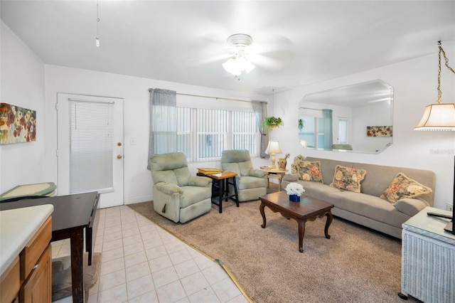 7740 Boca Ciega Dr Unit 204, St Pete Beach, FL 33706 - living room featuring light tile patterned floors, ceiling fan, and light carpet